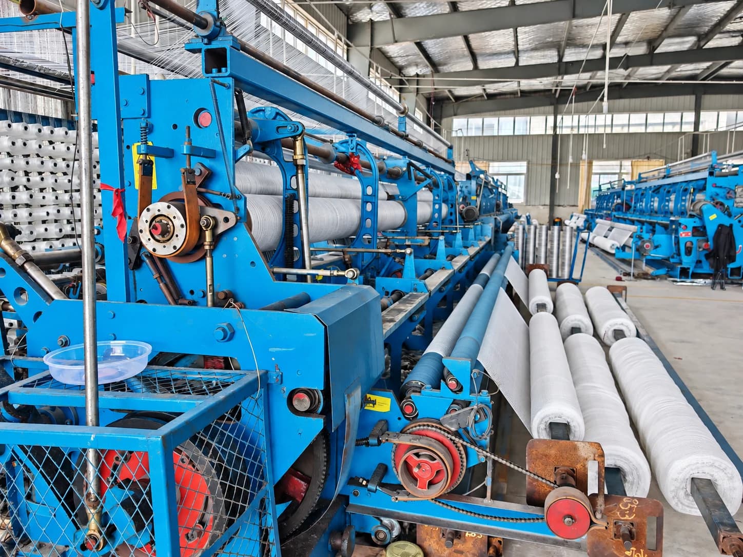 Fishing net weaving machines on the factory production line
