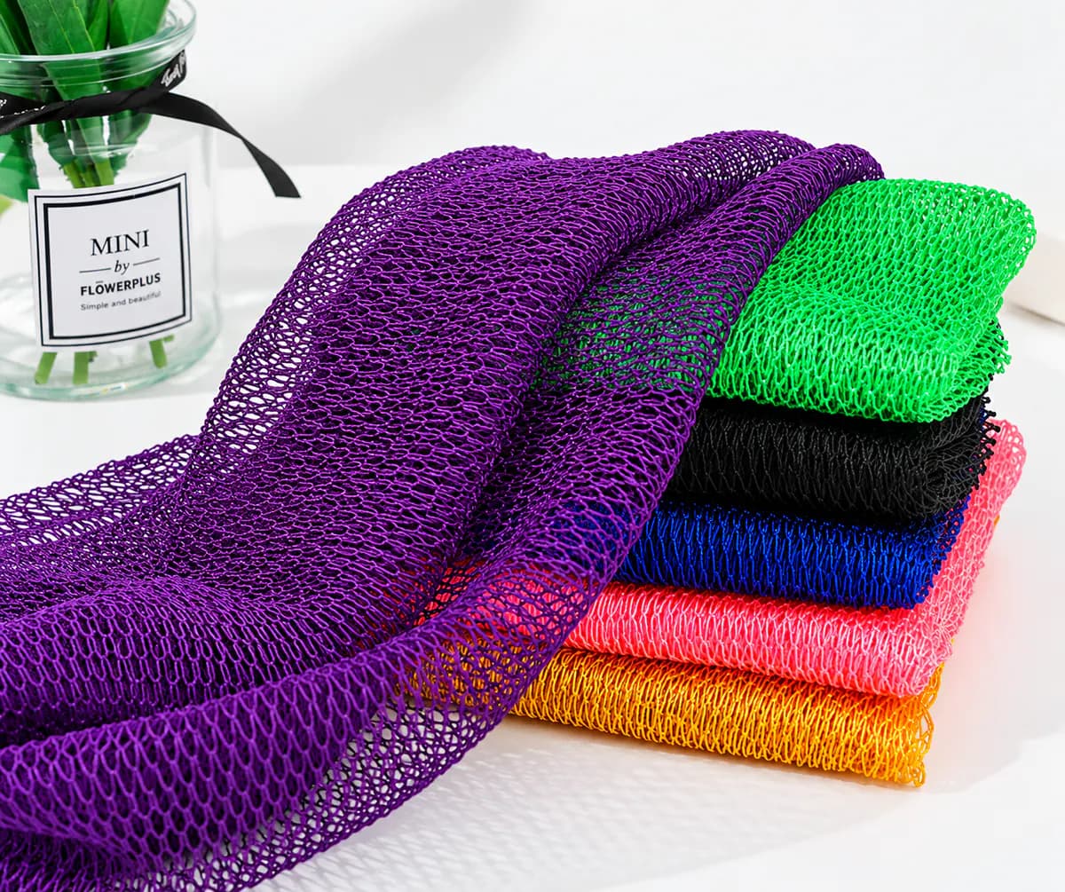 Colorful African net sponge mesh showing open-weave texture and different color options