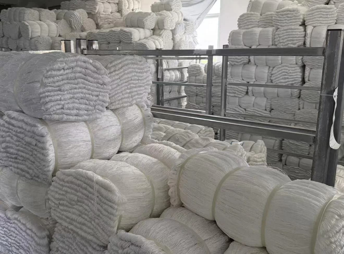 Finished white fishing net bundles prepared in warehouse stock